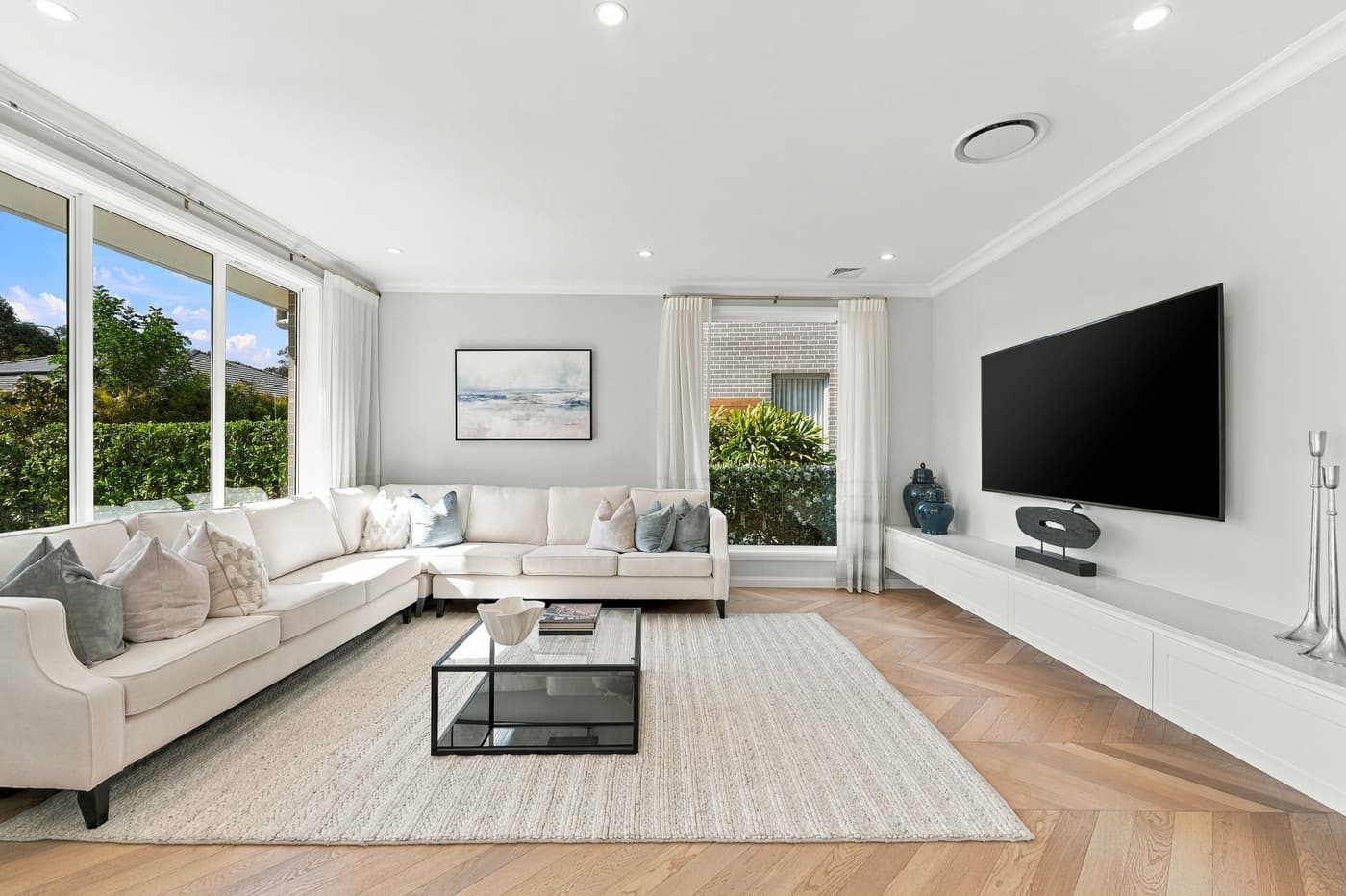 White living room with herringbone floor